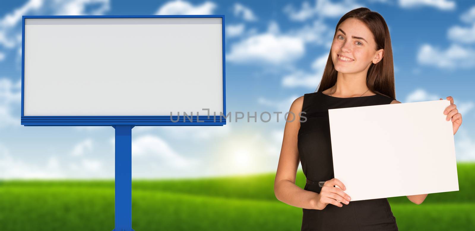 Businesswoman holding paper sheet. Blank billboard, blue sky and green grass as backdrop