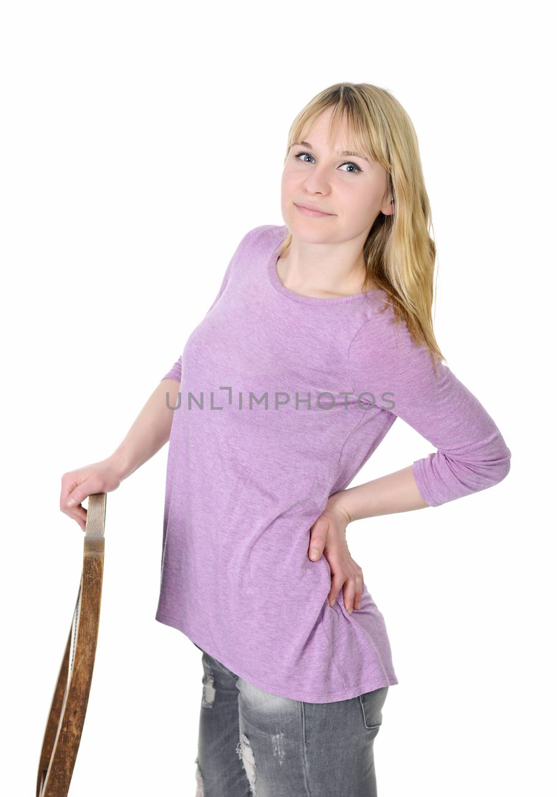 smiling young blond woman standing on chair