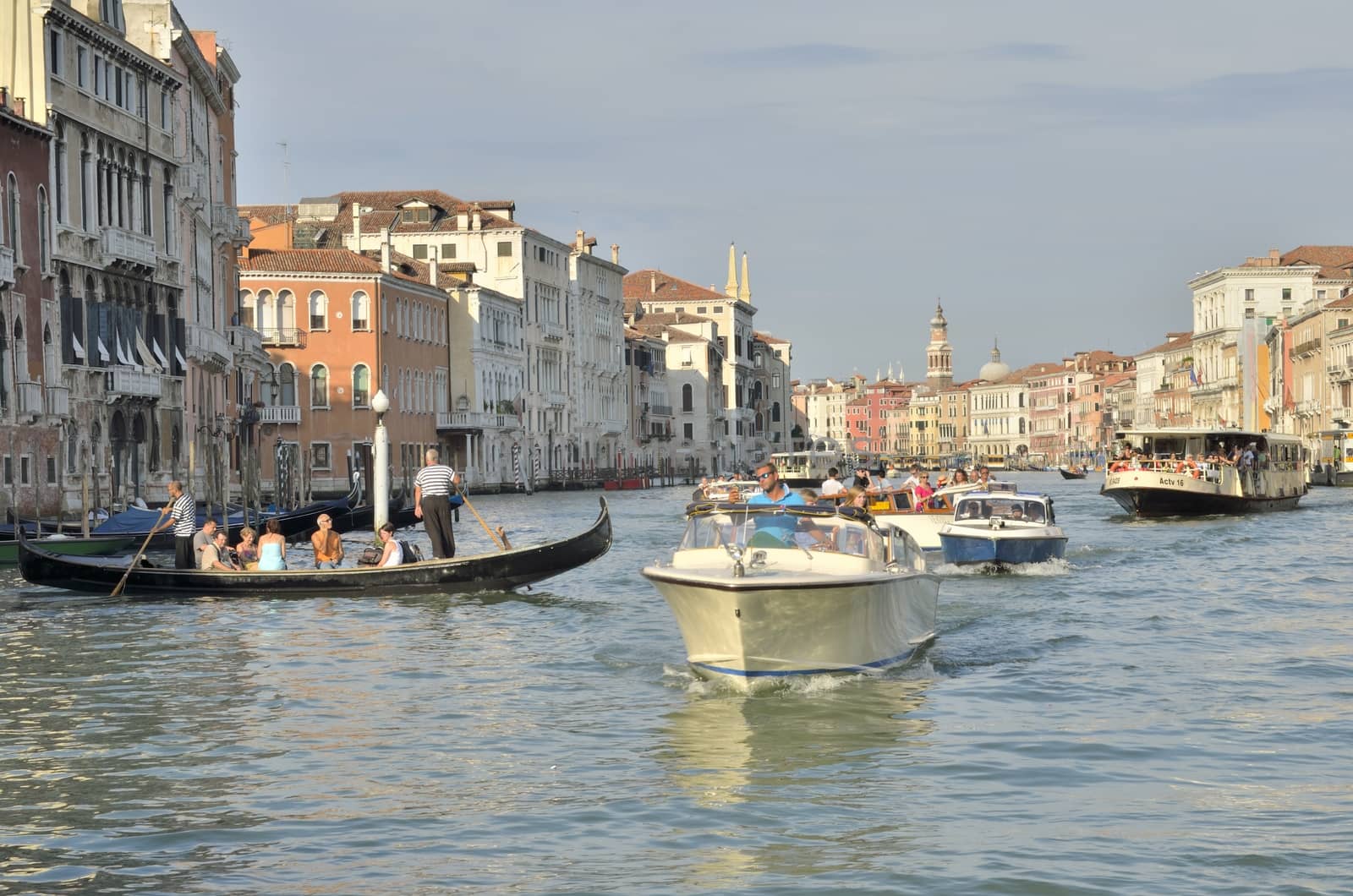 A lot of boats sailing on the Grand Canal in Venice.