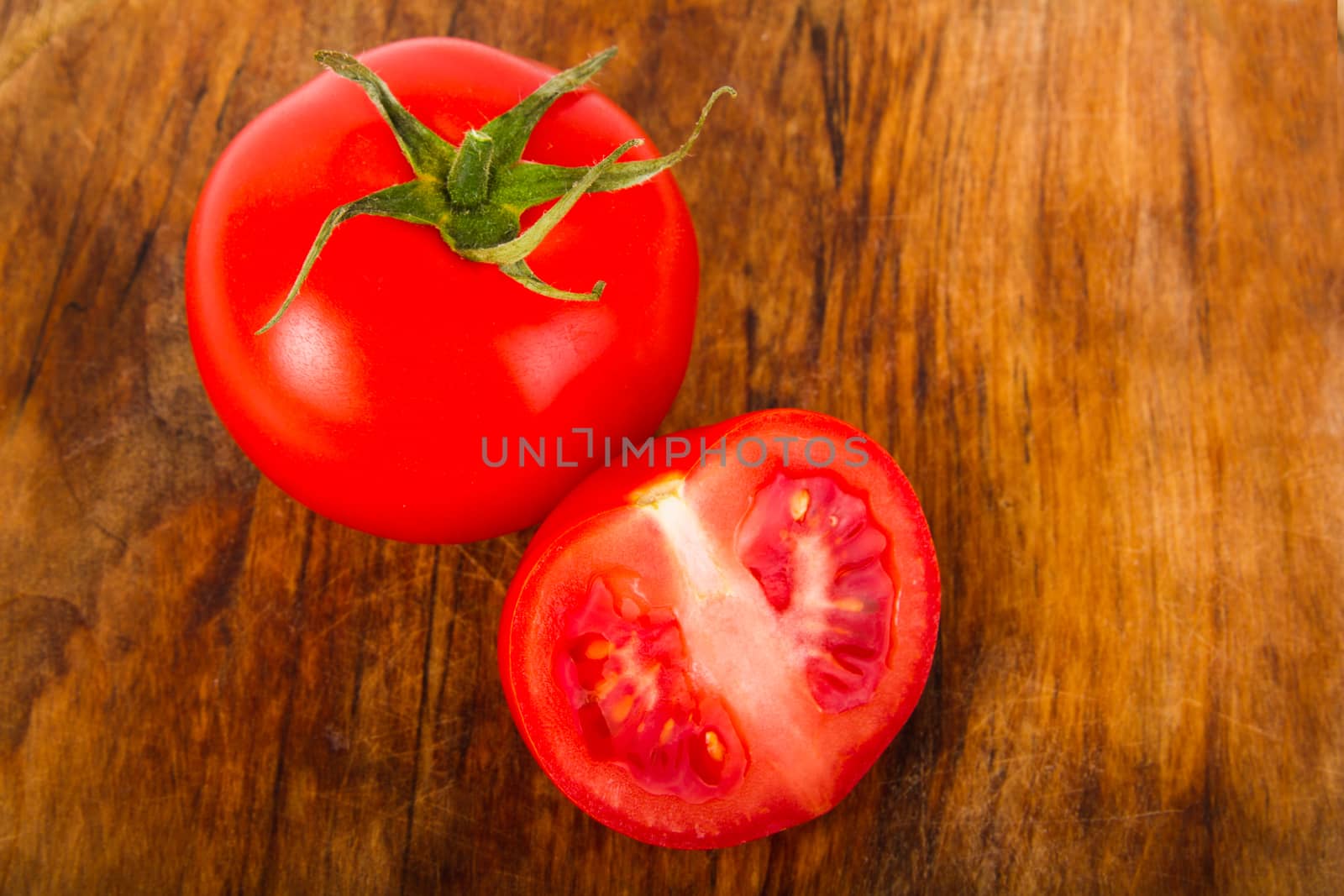 Juicy ripe tomatoes on the table - Stock Image