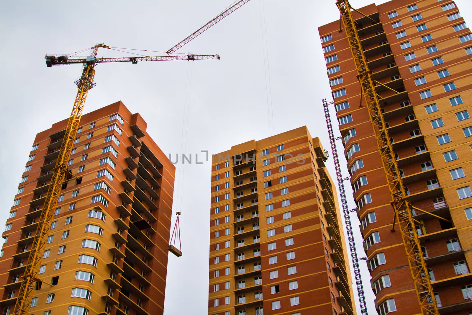 High rise construction. Brick houses under construction