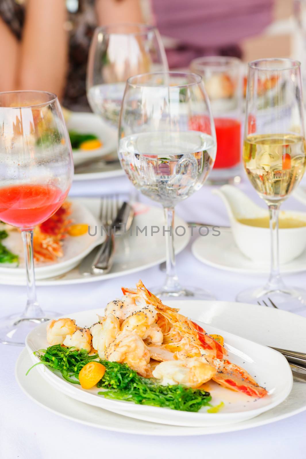 Prepared lobster and sea weed served on plates