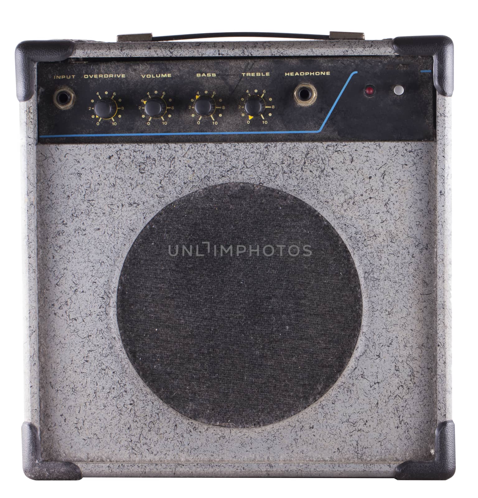 Small old dusty amp for guitar and bass guitar, isolated over white