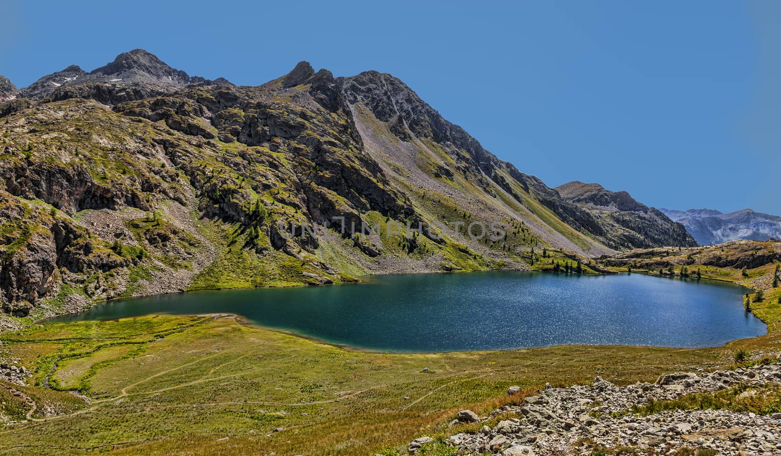 Image of the Big Lake from the Vens Lakes located at 2327 m in Maritime Alps in Mercanotur Park in the south of France. The Vens Lakes are a set of five lakes flowing one in the other