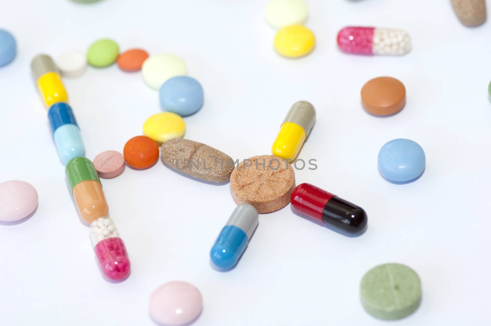 Prescription symbol Rx made of various capsules, pills and tablets