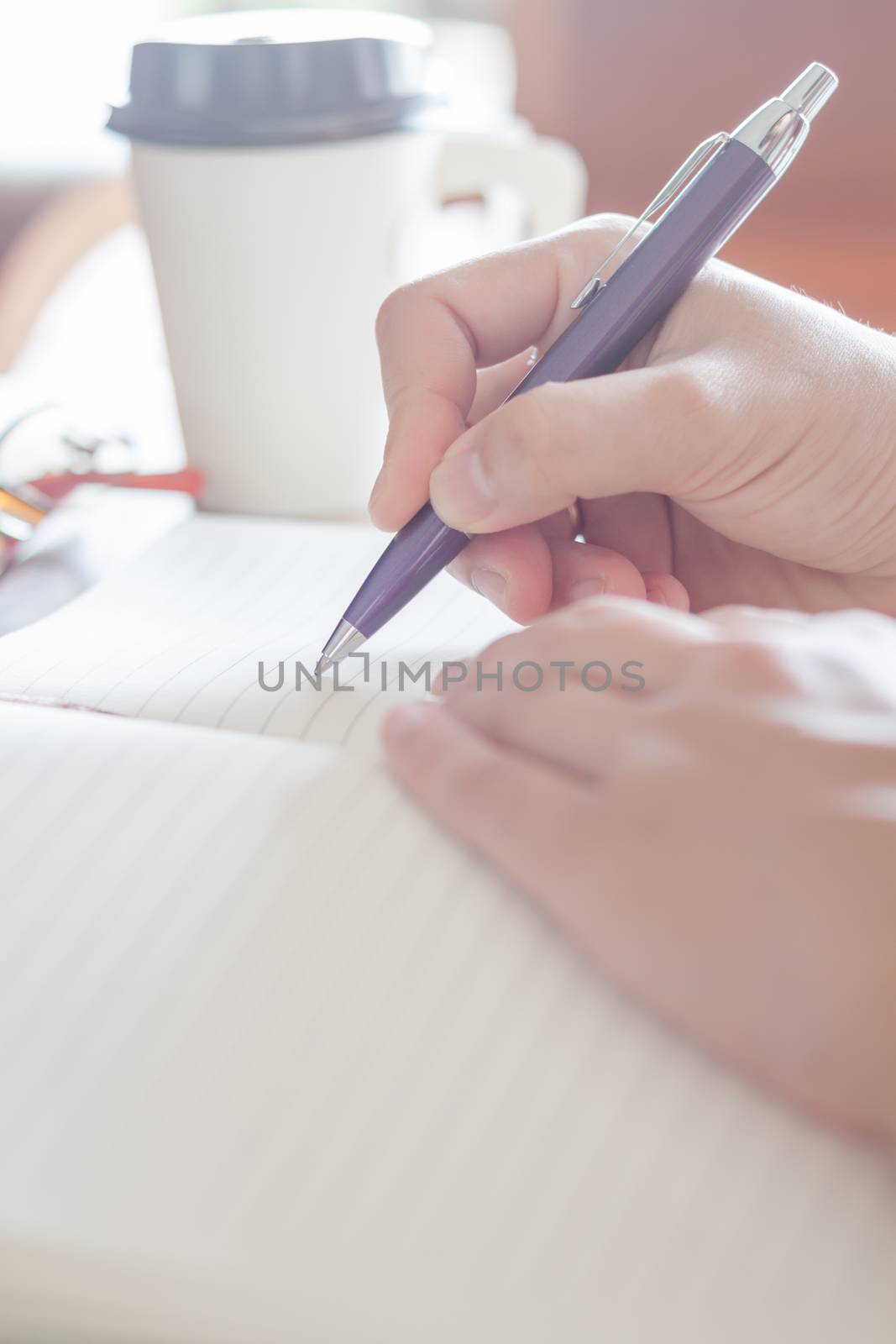 Making some important notes, stock photo