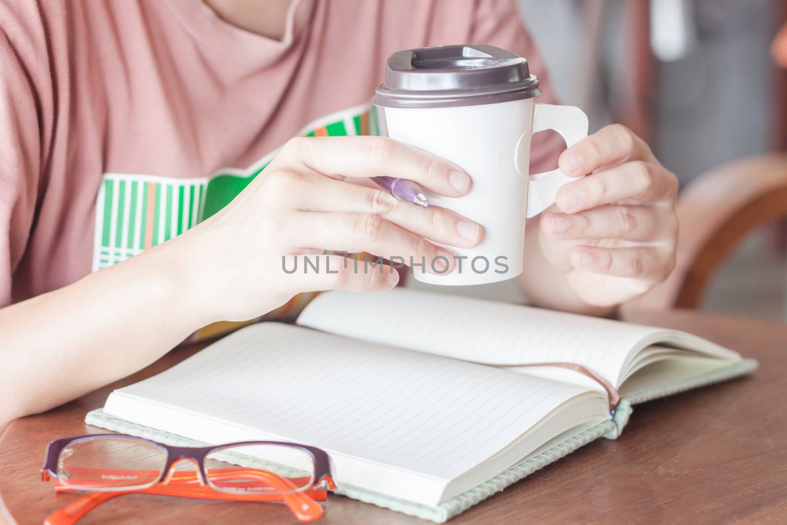 Woman working at coffee shop by punsayaporn