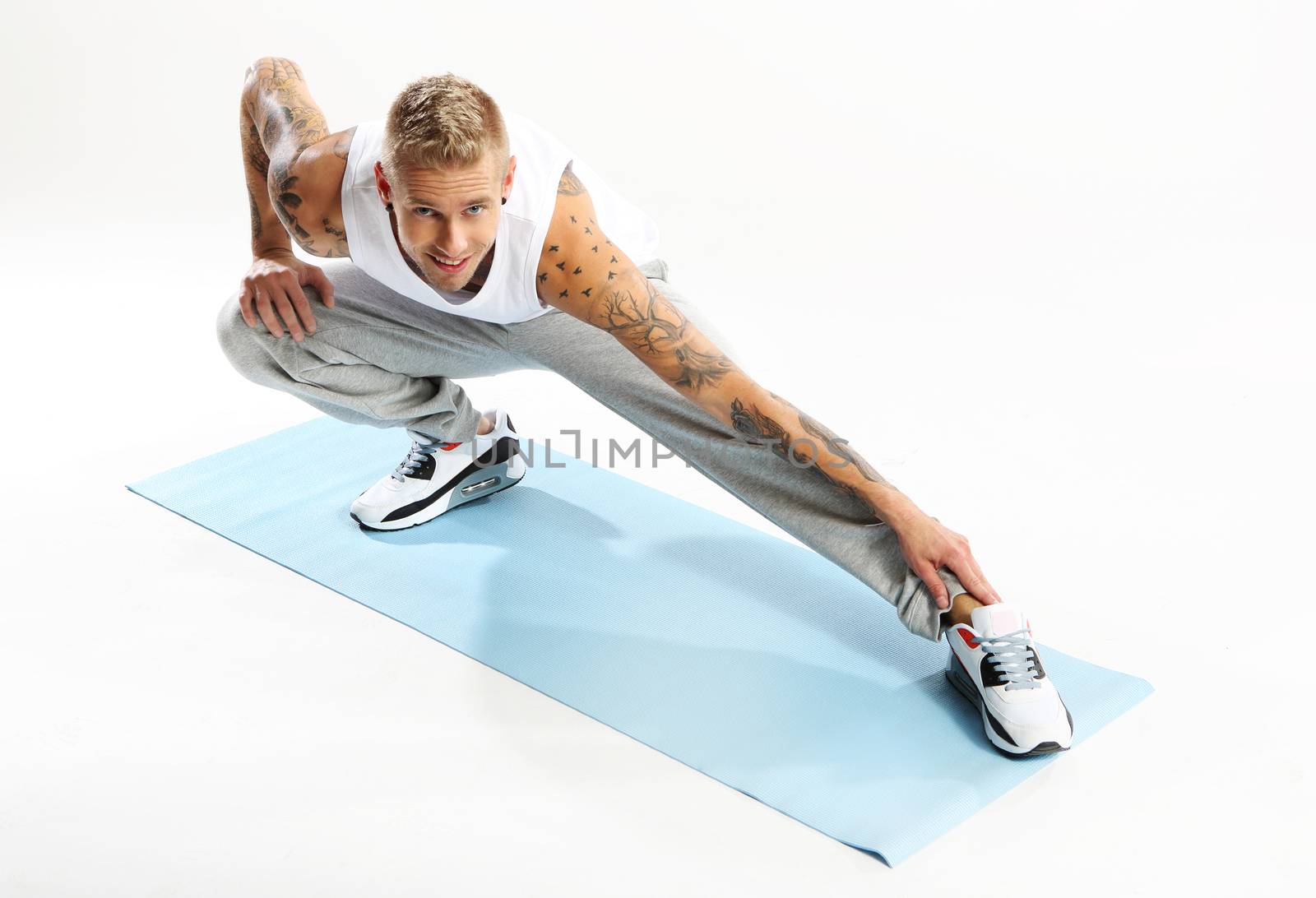 Stretching exercises on the mat by robert_przybysz