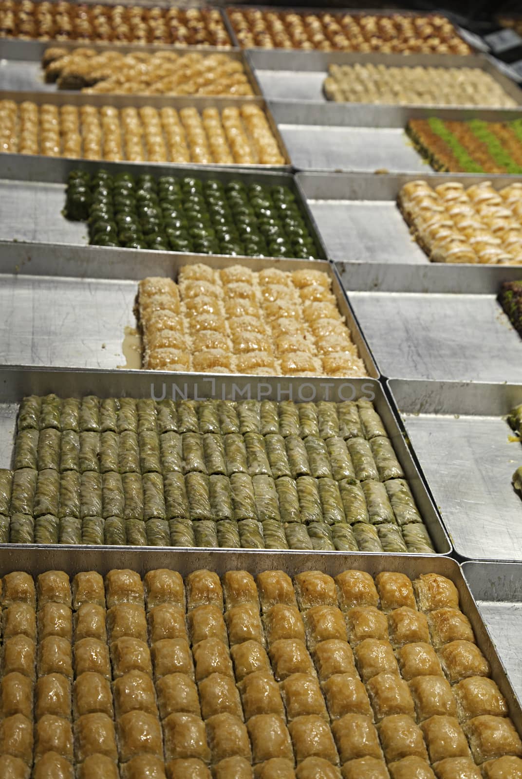 Various turkish baklava on trays in a shop