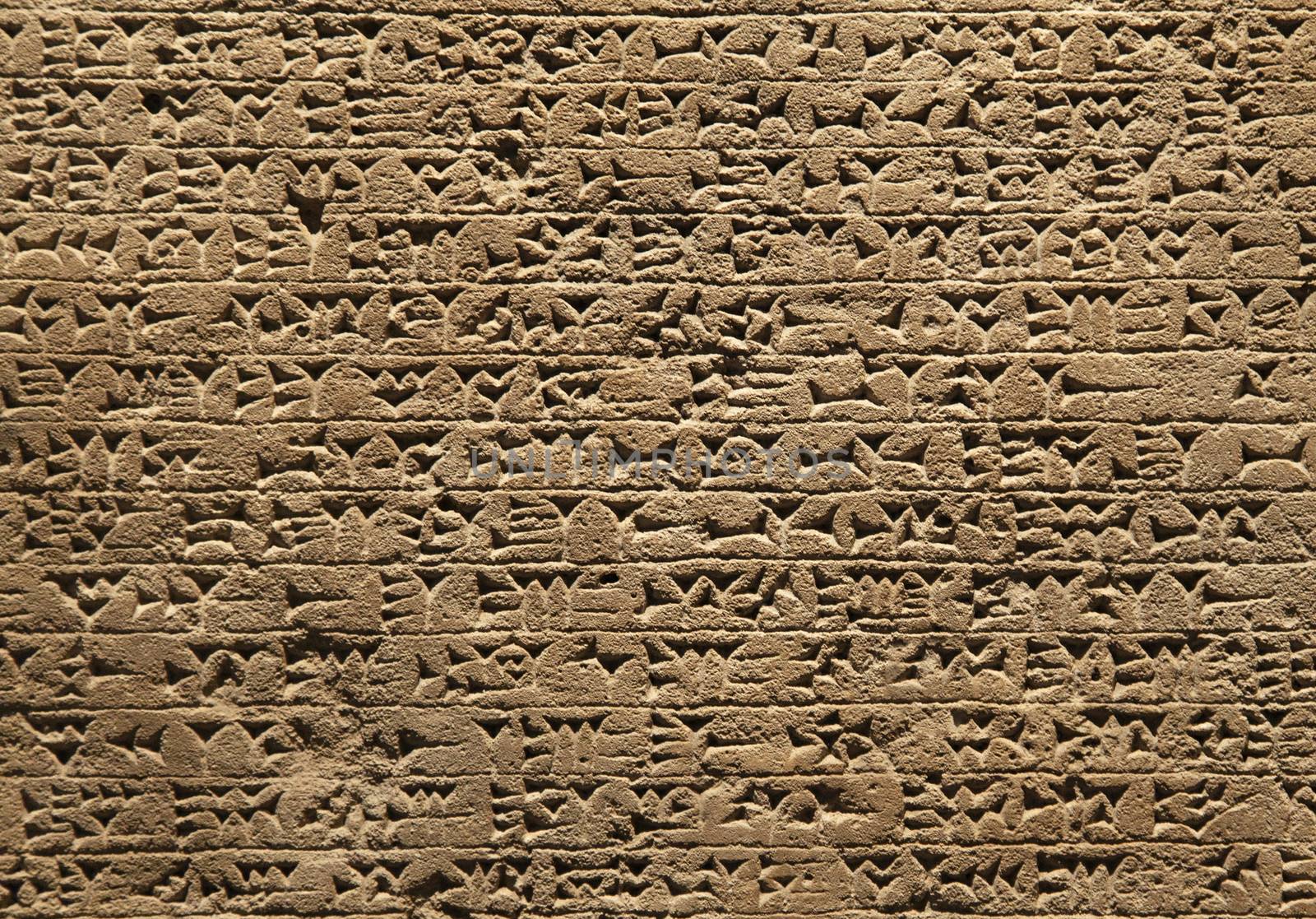 Close-up of ancient clay tablet with cuneiform writings