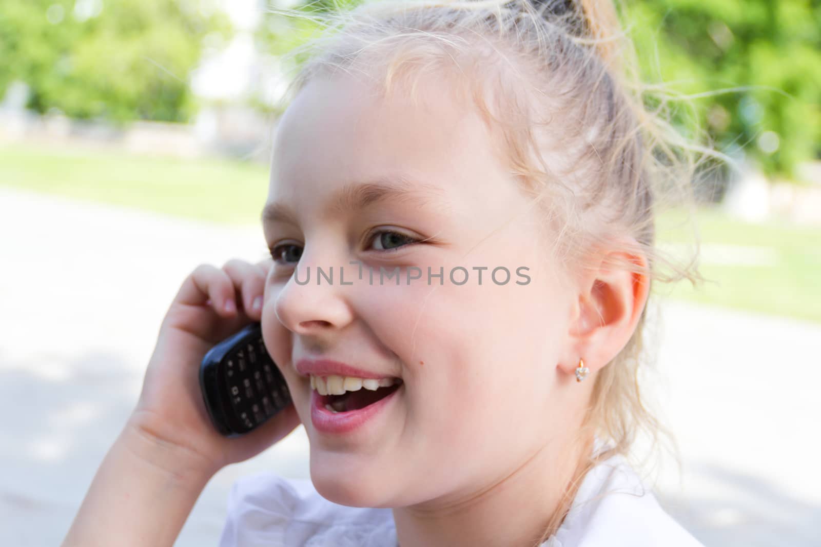 Photo of cute girl talking by cellular