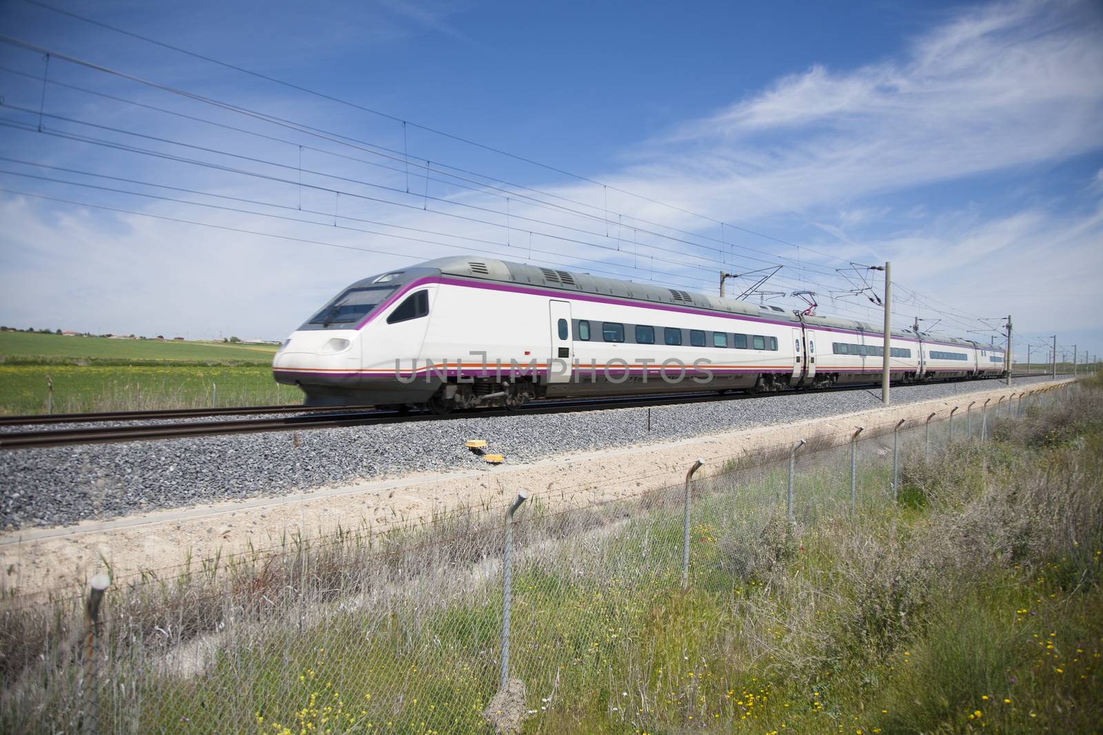 railway with high speed train at a landscape in Spain