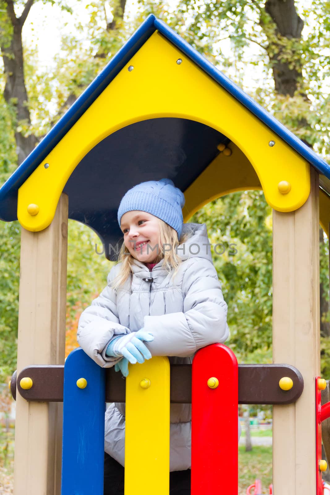 Photo of cute smiling girl in autumn