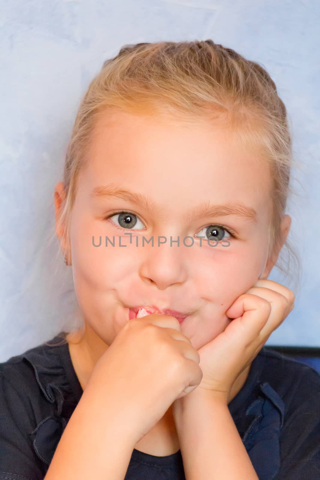 Photo of eating cute girl with blond hair