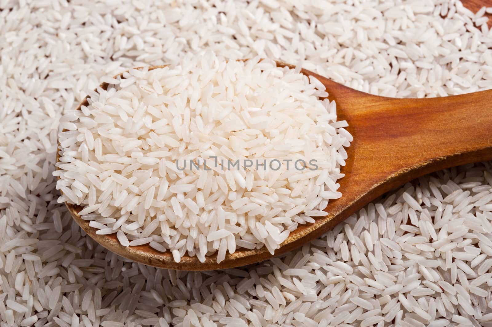 rice and wooden spoon