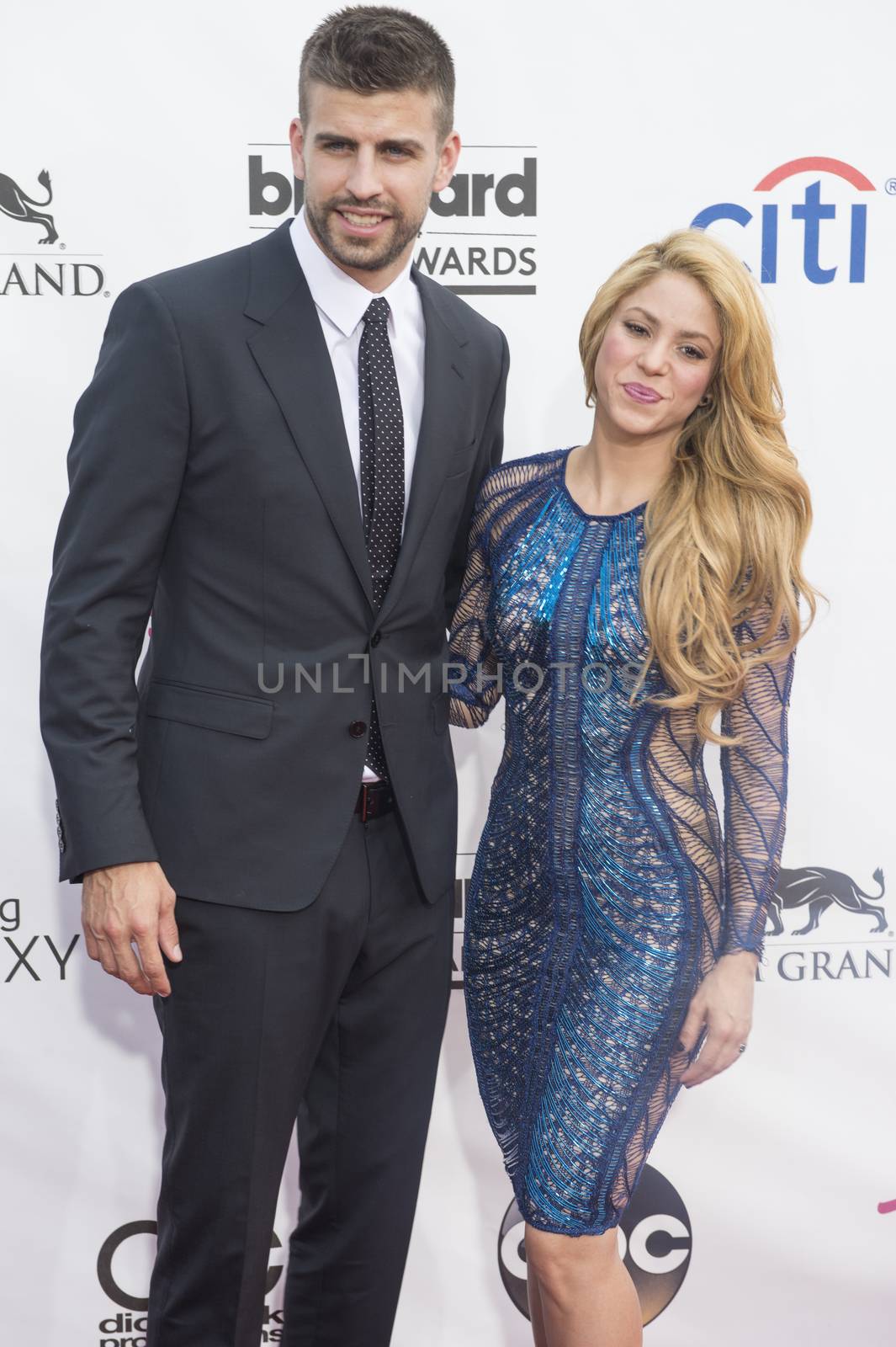 LAS VEGAS - MAY 18 : Soccer player Gerard Pique (L) and recording artist Shakira attend the 2014 Billboard Music Awards at the MGM Grand Garden Arena on May 18 , 2014 in Las Vegas.