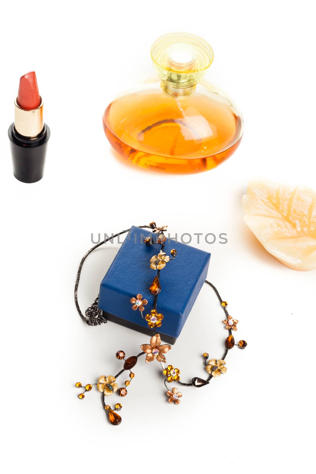 fashion necklace with box, perfume bottle and red lipstick