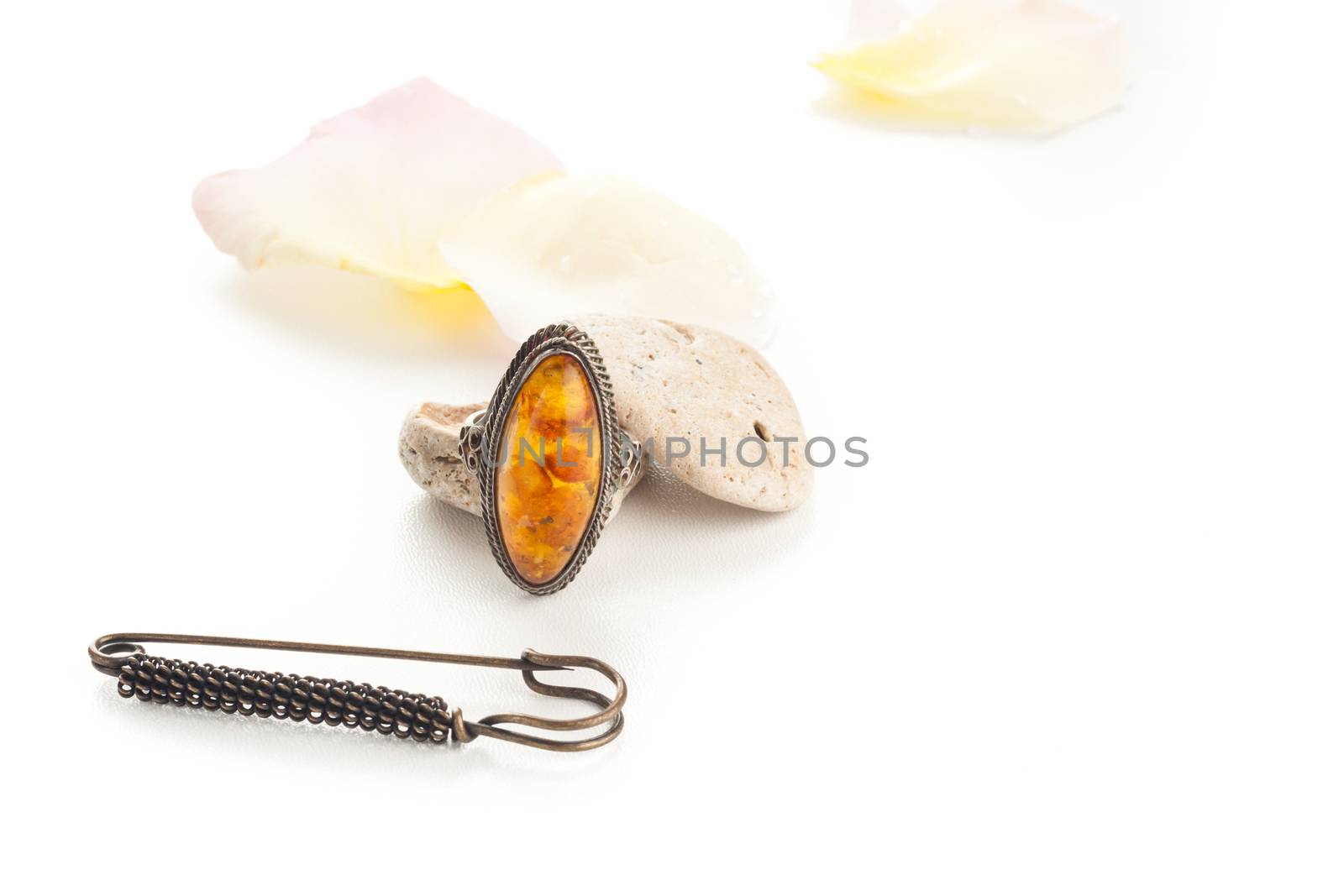 vintage orange ring with stones and rose petals