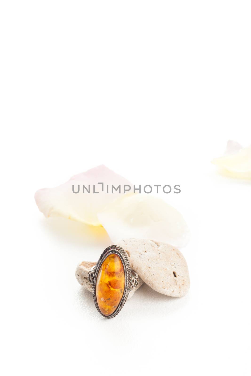 vintage orange ring with stones and rose petals