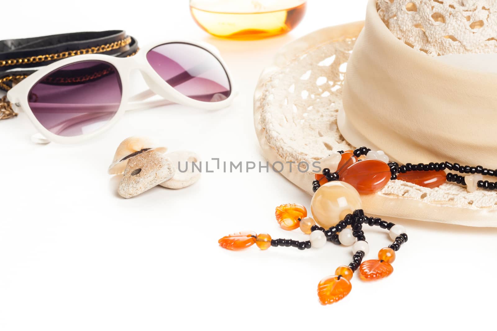 summer fashion accessories with hat, sunglasses, necklace, perfume