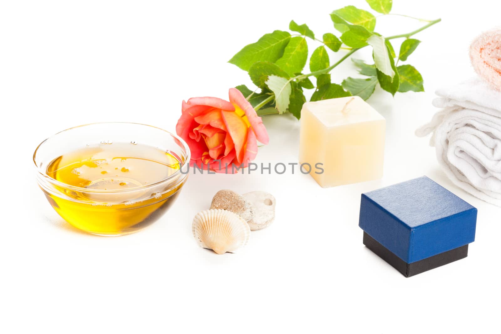 cosmetics healthy aromatherapy herbal oil, candle and rose