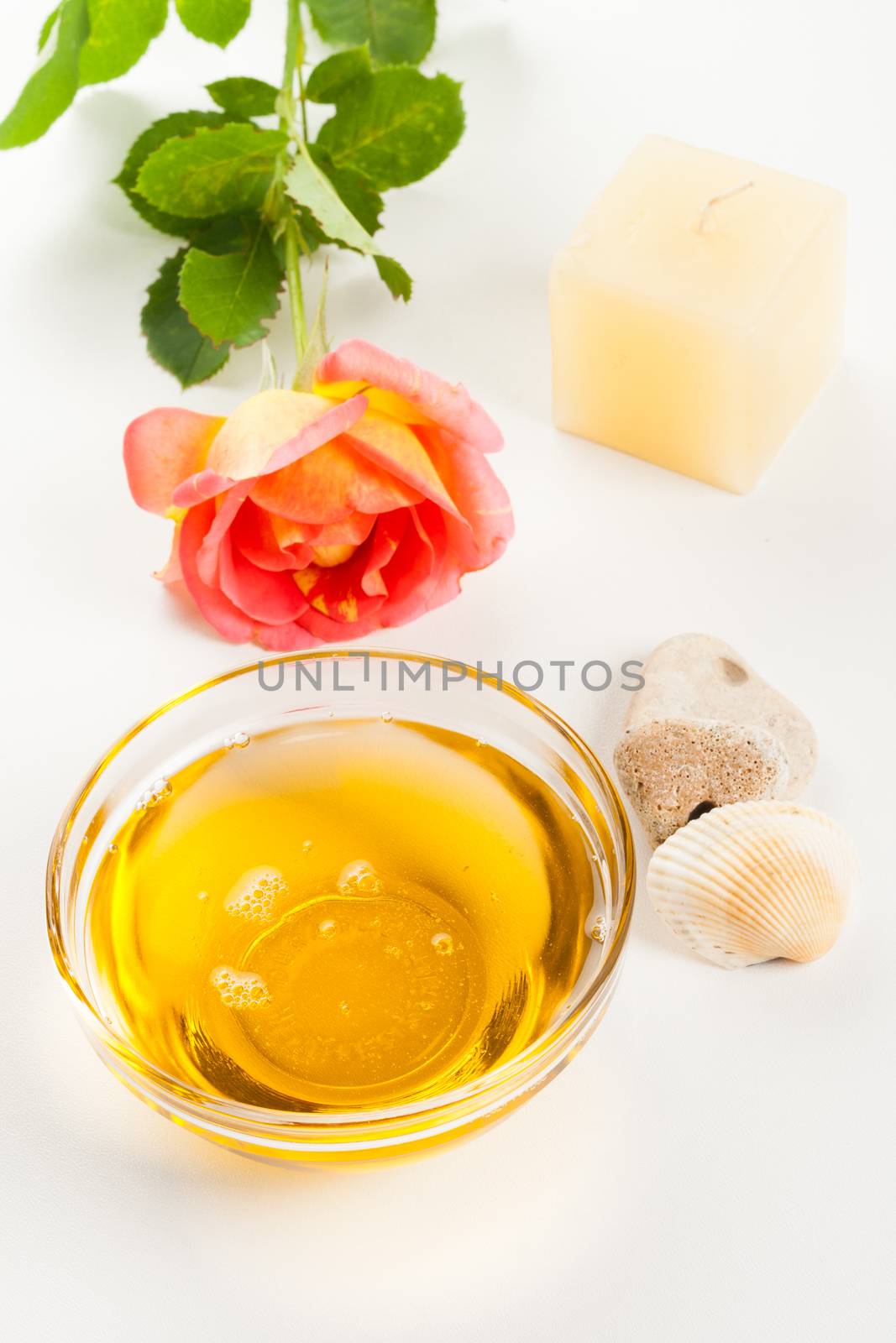 cosmetics healthy aromatherapy herbal oil, candle and rose