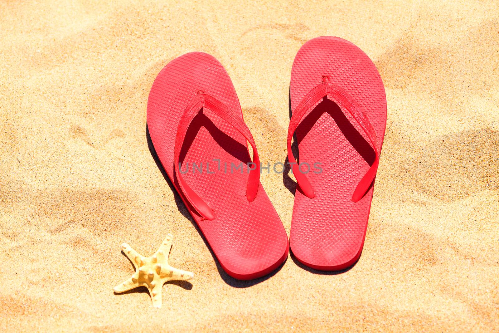 Flip-flops on a sand by Nobilior