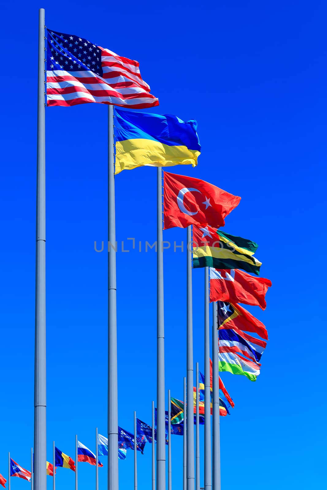 Flags against blue sky, copyspace
