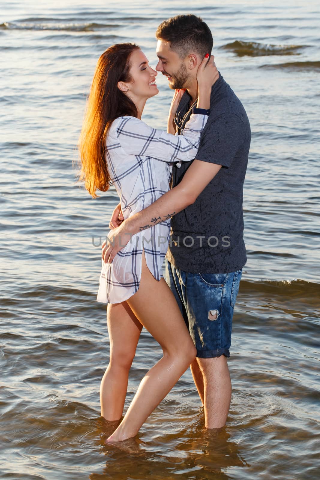 Summer, love. Attractive couple on the beach