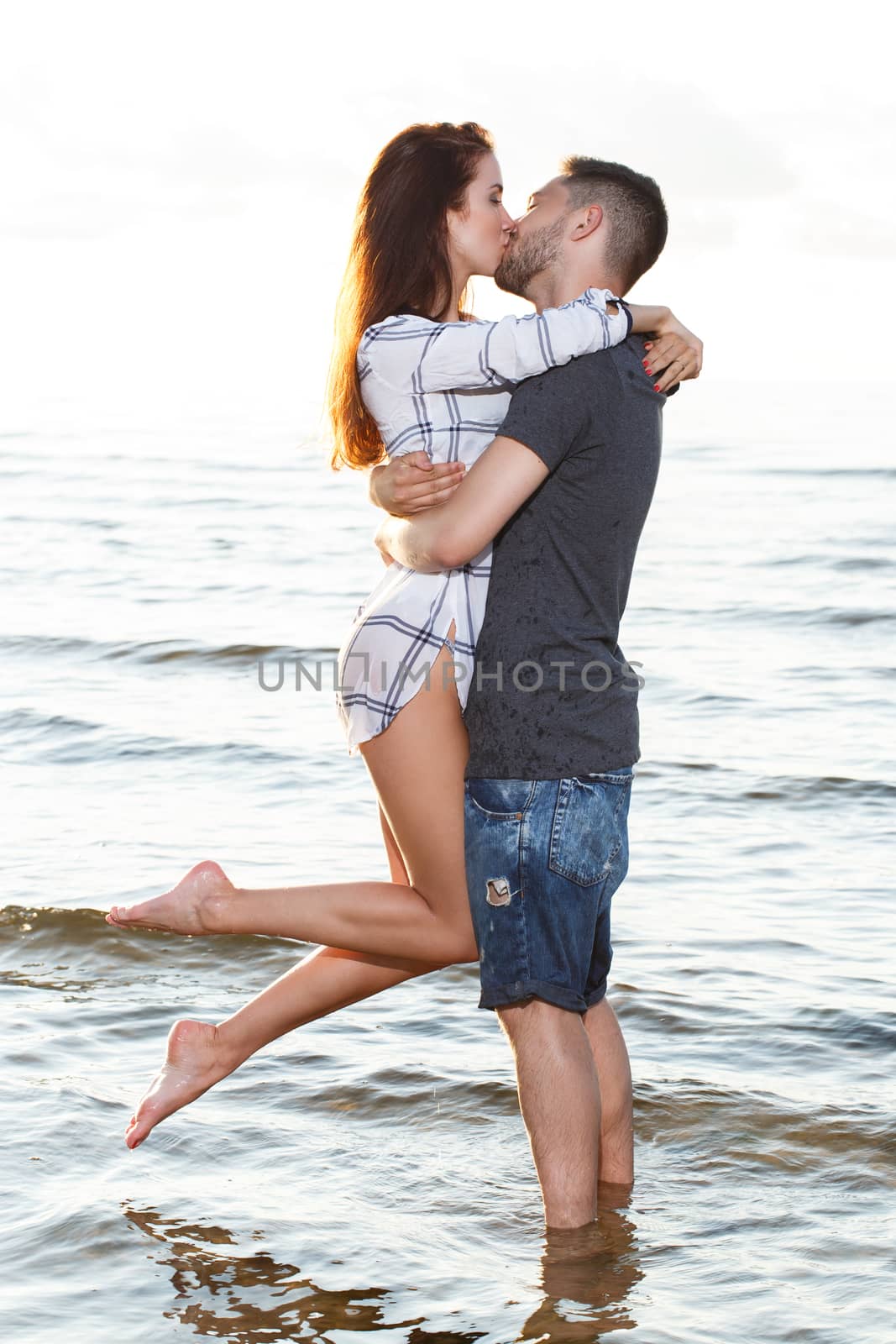 Beautiful couple on the beach by rufatjumali