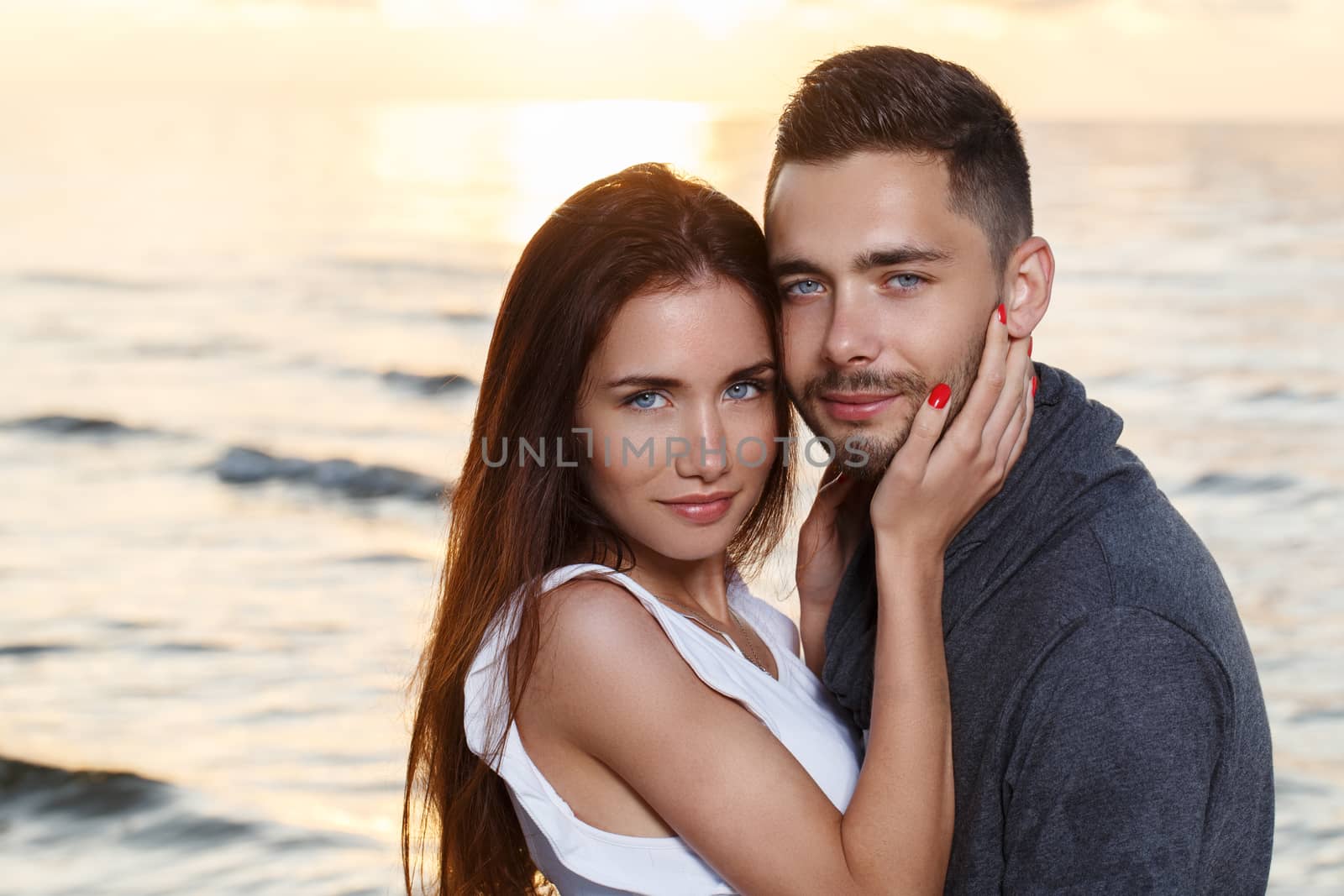 Summer, love. Attractive couple on the beach