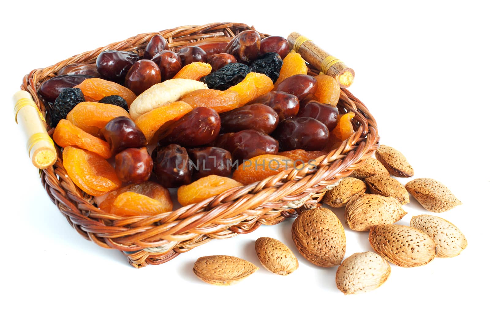 Almonds and dry fruits isolated on white background