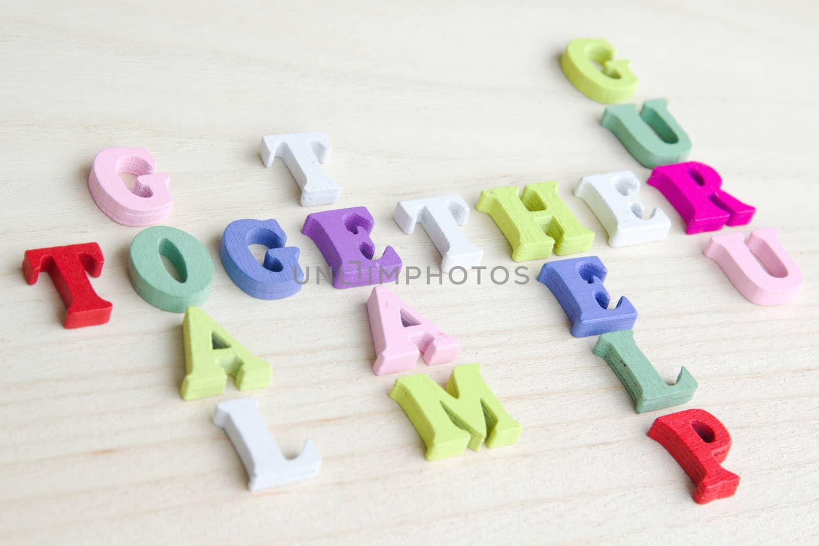 Photo shows a detail of the crossword puzzle funny sign with symbols on a table.