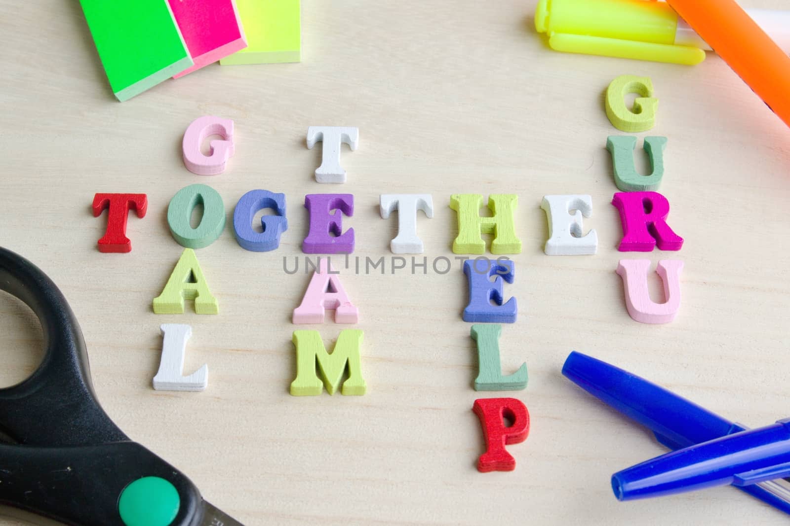 Photo shows a detail of the crossword puzzle funny sign with symbols on a table.