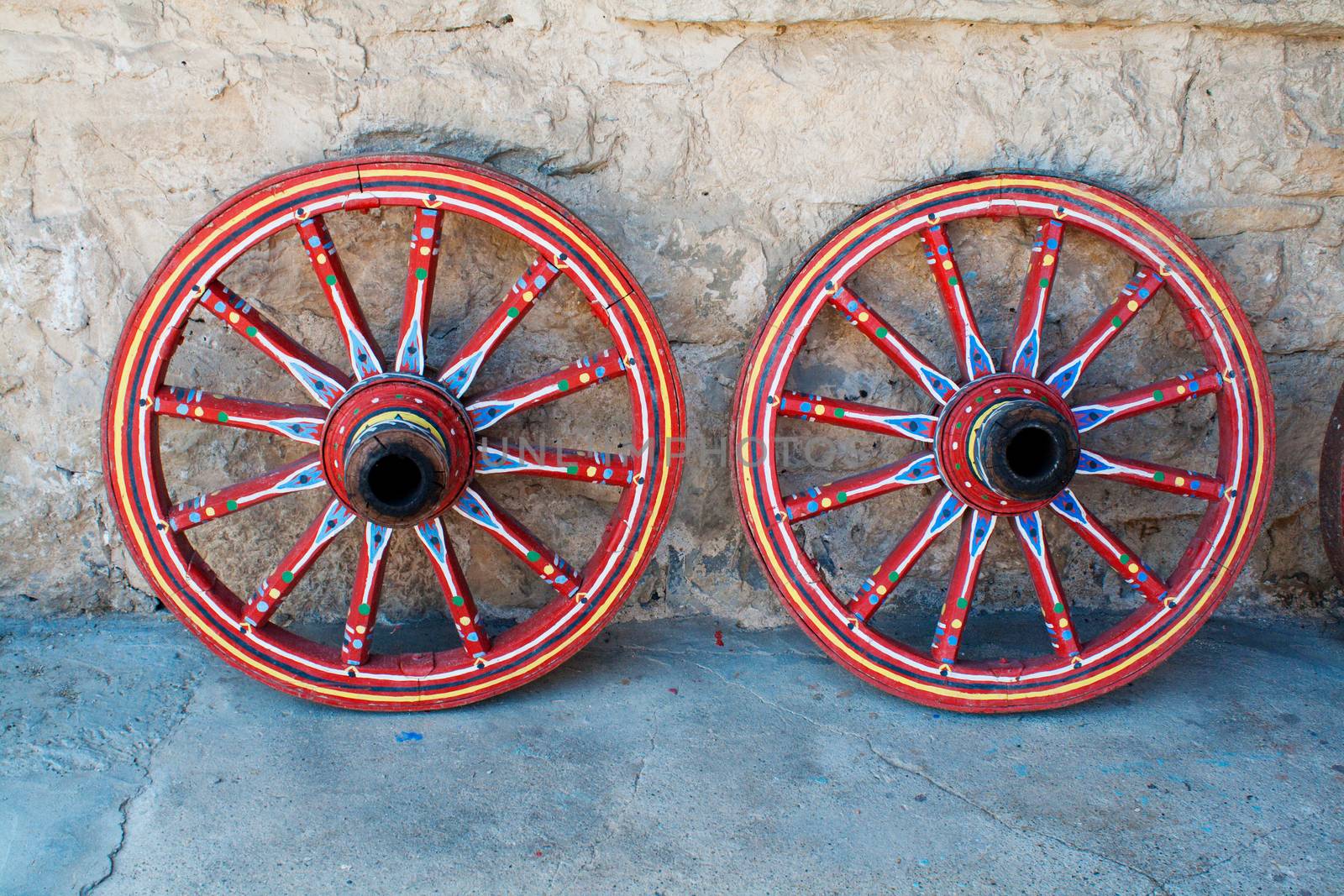 Wagon wheel . Close-Up of an antique wagon wheel located in a fortress.