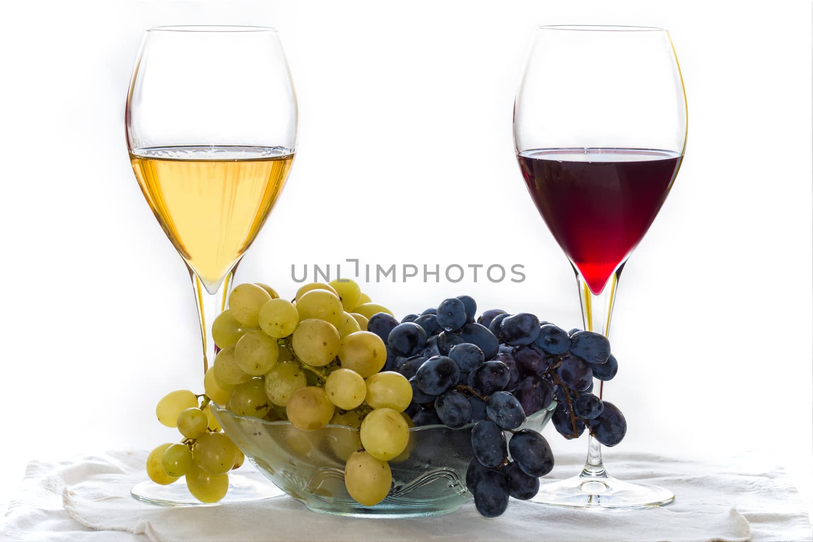 Grape with red and white wine isolated on white background