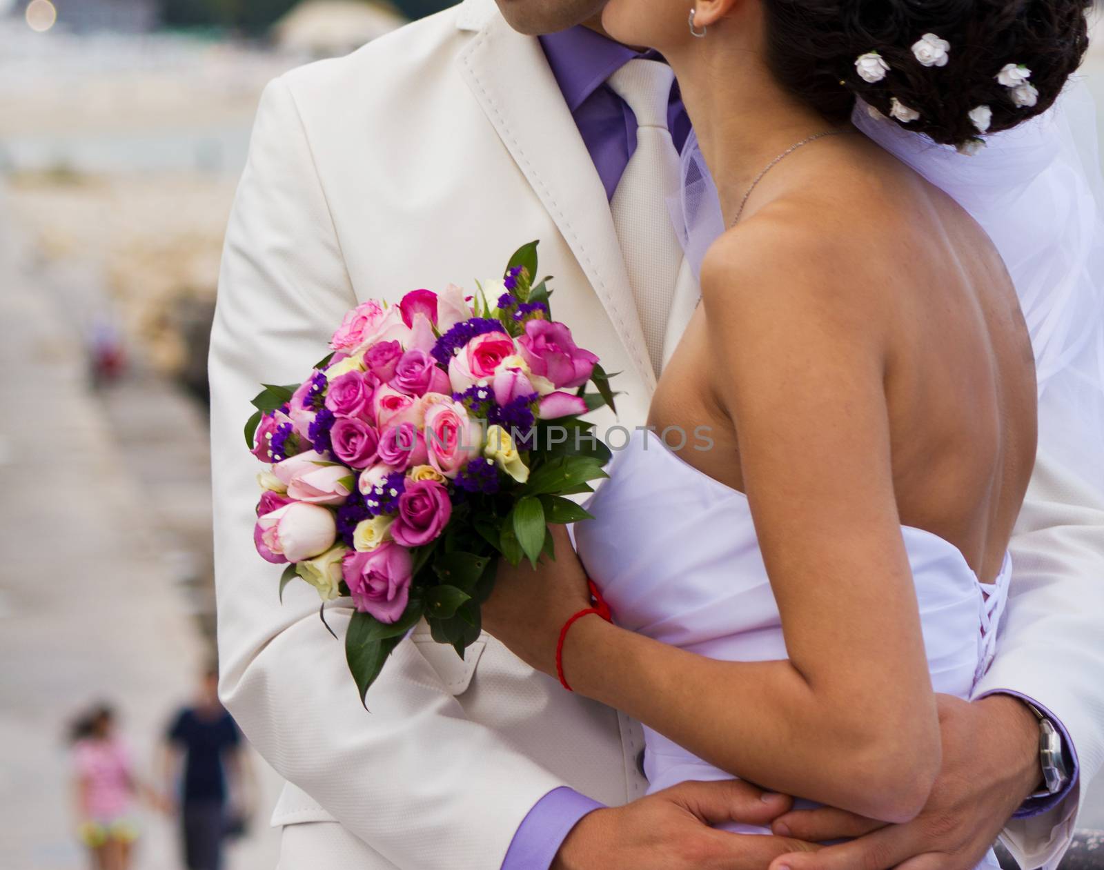 Bride and groom on their wedding day hugging.