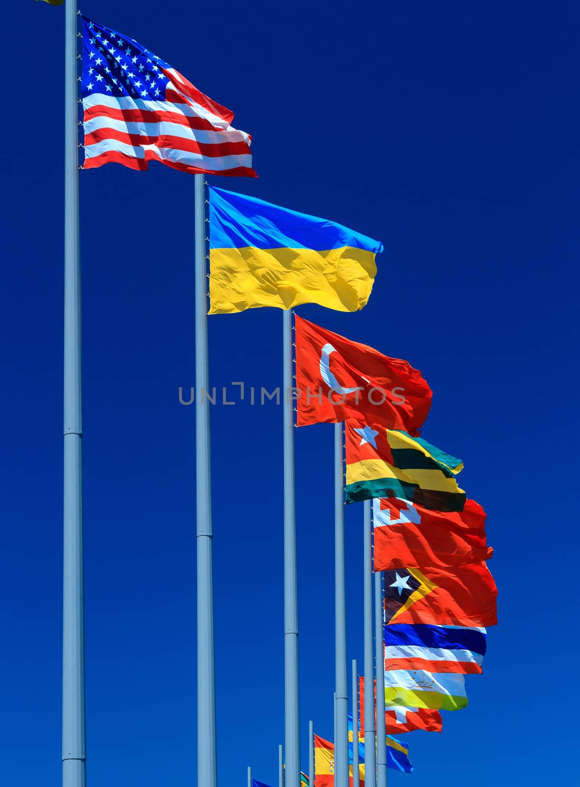 Flags against blue sky, copyspace by Nobilior