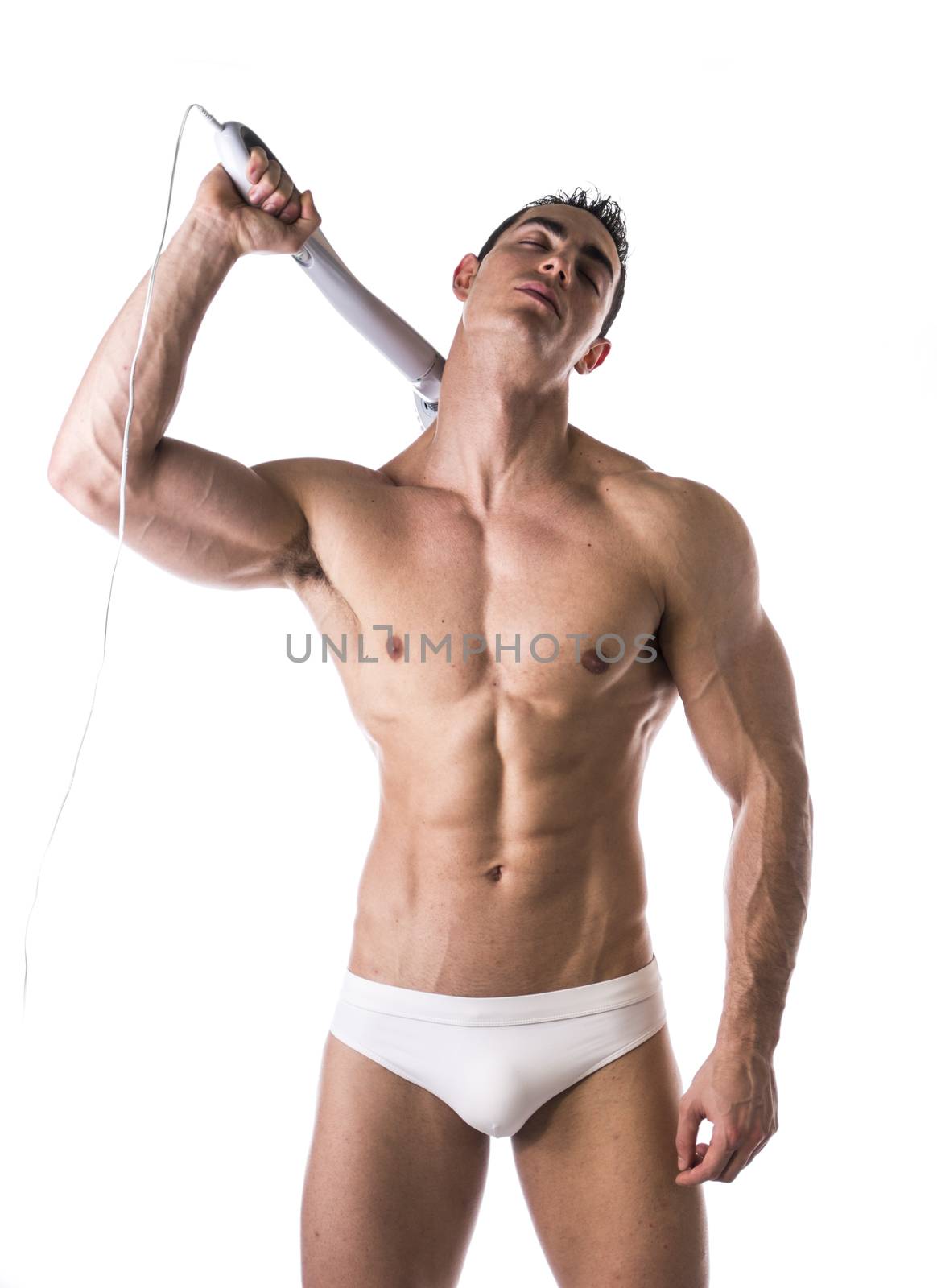 Sexy Man in White Brief Holding Massage Device by artofphoto