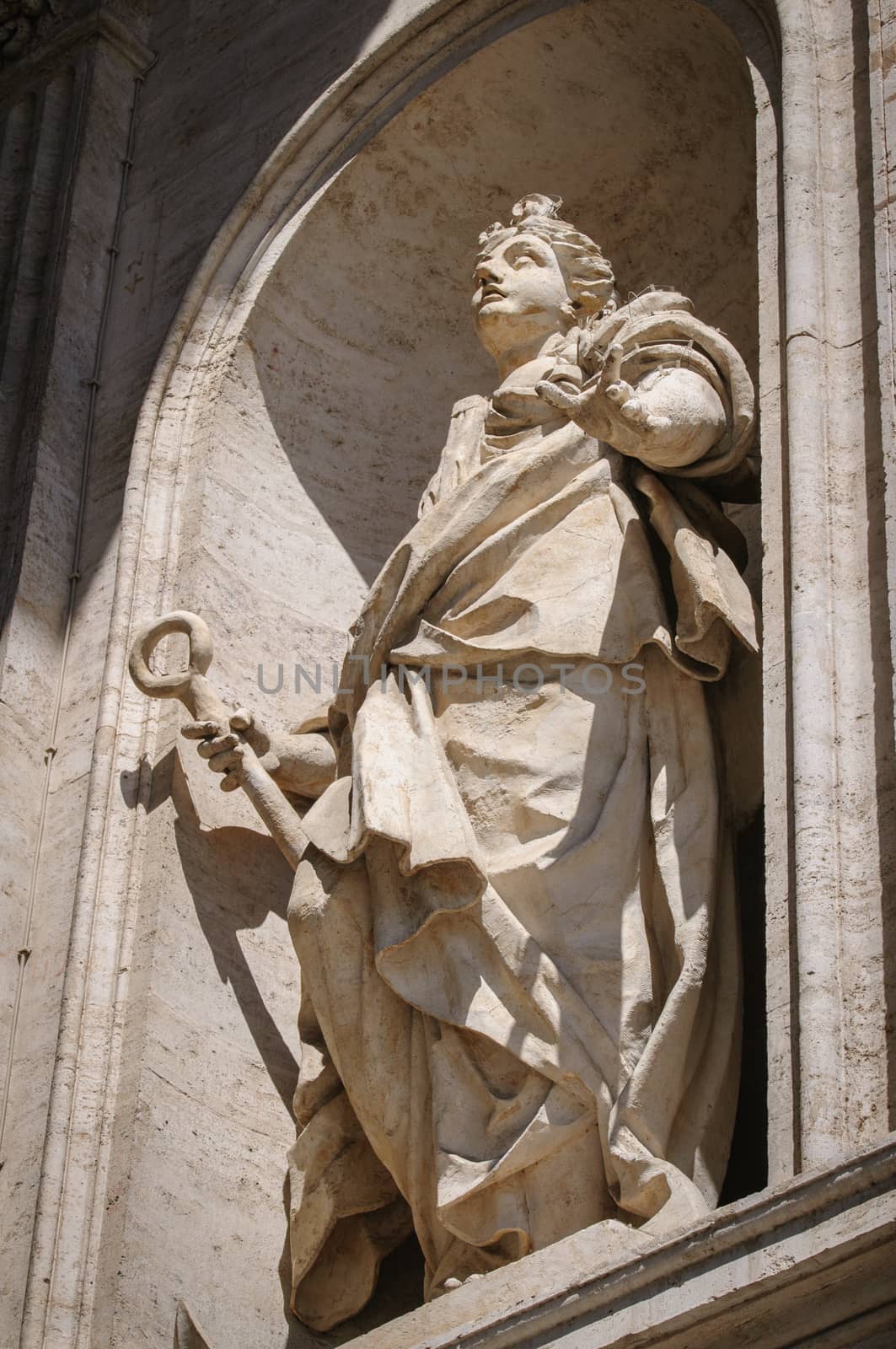 Statue on the wall of St. Peter Cathedral in Rome, Italy