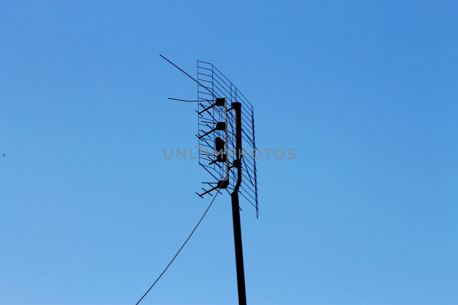 Television antenna for home TV in blue sky by scullery