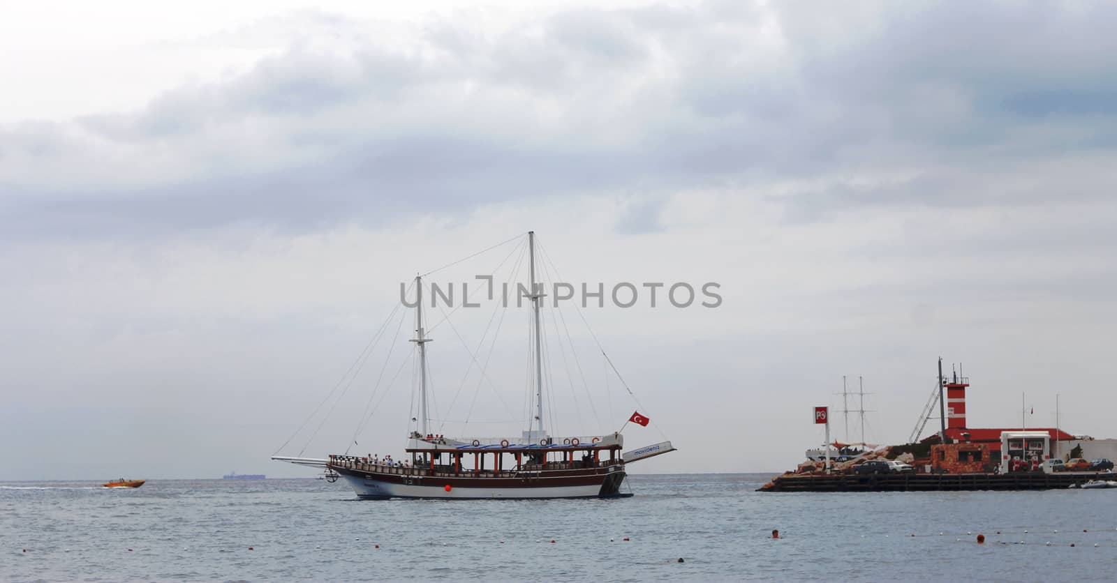 Sail ship moving away from the shore