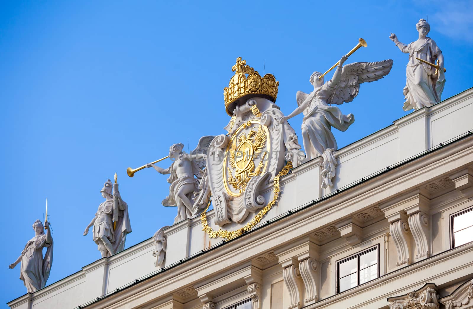 VIENNA, AUSTRIA - AUGUST 4, 2013: Architectural artistic emblem decoration symbol of Imperial Chancellory Wing (Reichskanzleitrakt ) on Hofburg palace, Vienna, Austria.