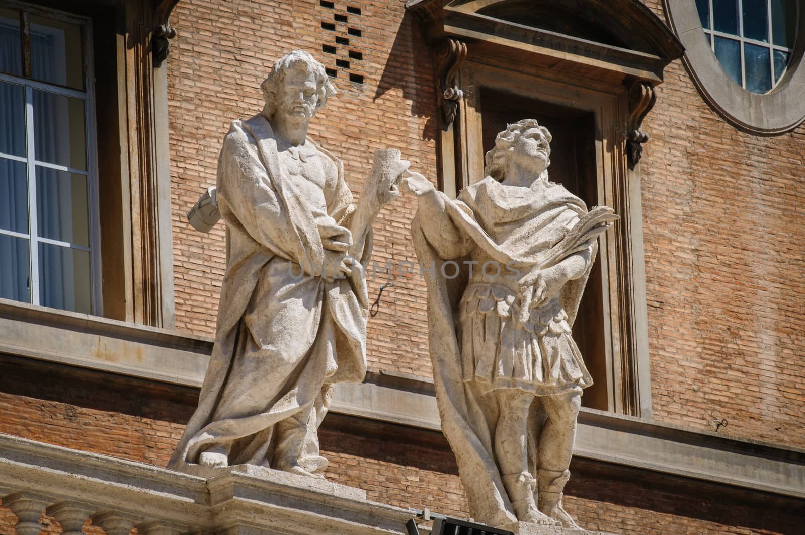 Statues on top of collonnade of St. Peters square in Rome, Italy