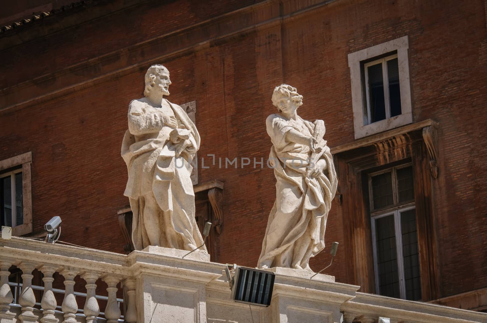 Statues on top of collonnade of St. Peters square in Rome, Italy