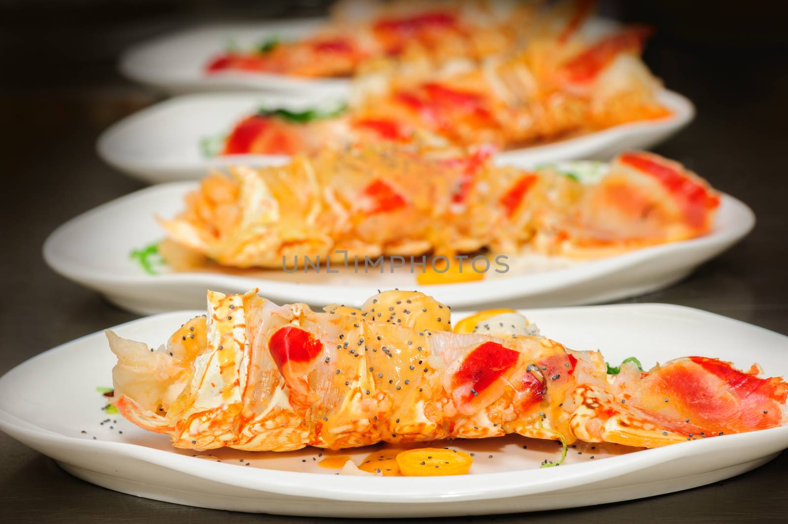 Prepared lobster and sea weed on plates