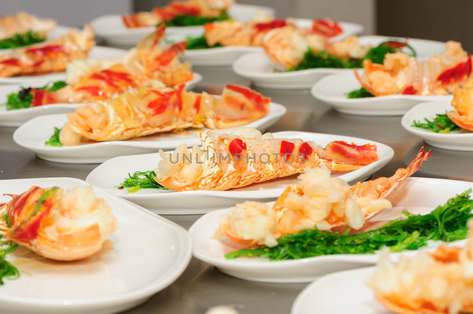 Prepared lobster and sea weed on plates