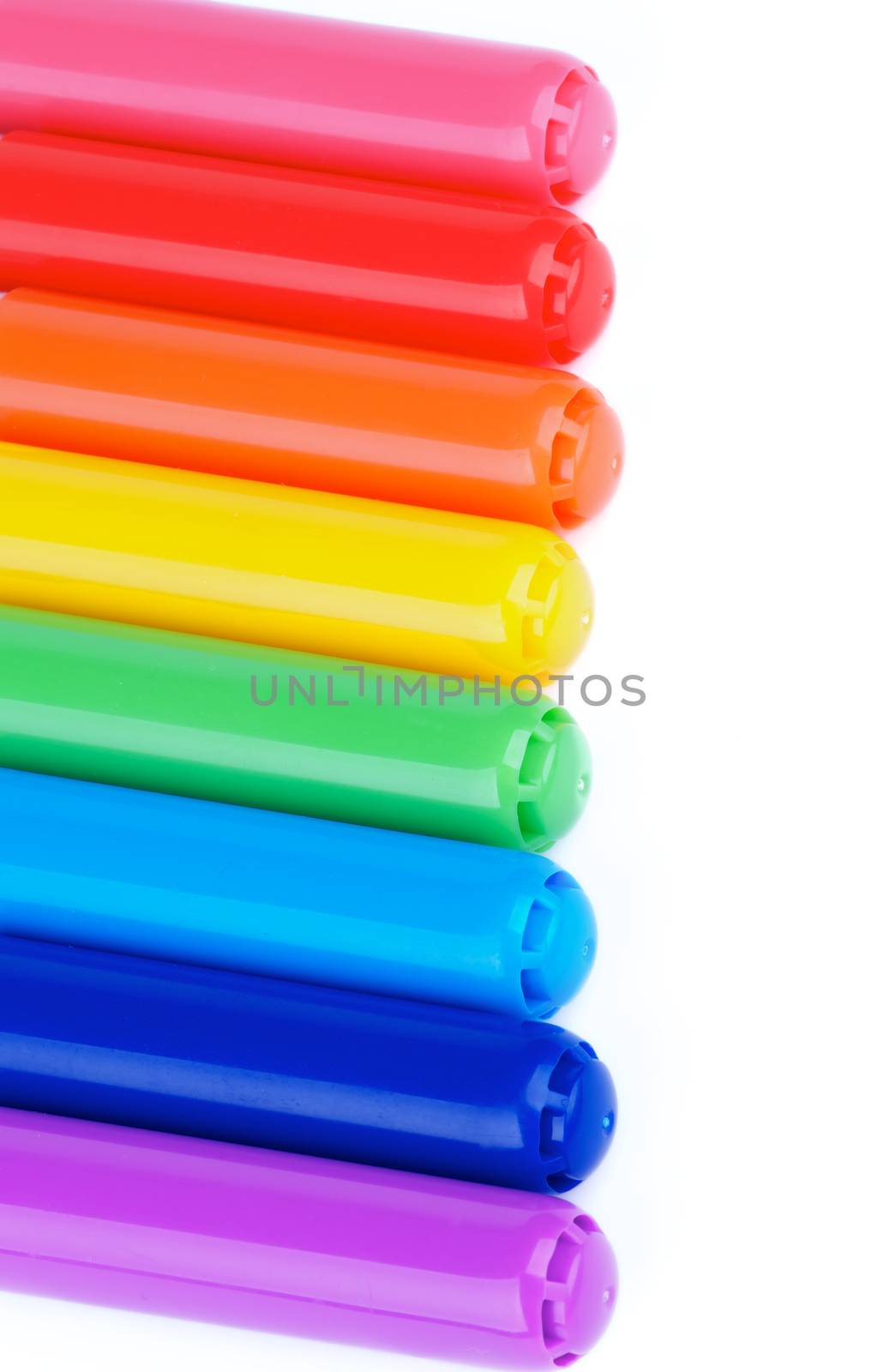 Rainbow Colored Felt Tip Pens with Closed Cups as Frame isolated on white background