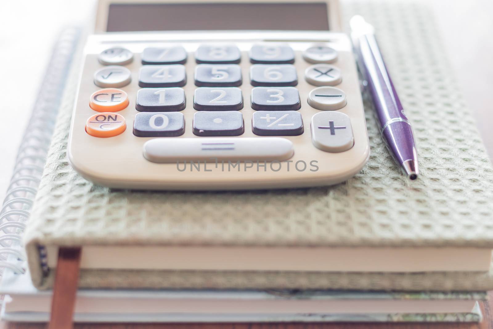 Closeup calculator, pen and notebooks, stock photo