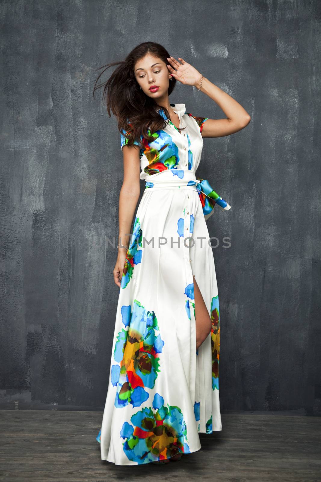 Glamour Portrait of young woman in white summer dress